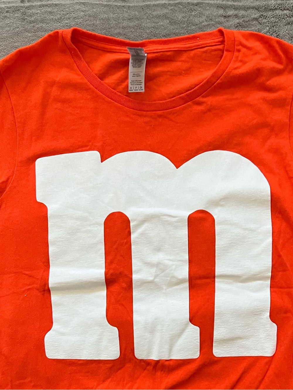 Gildan Junior’s Bright Orange Tee with Large White 'm' Graphic Size S